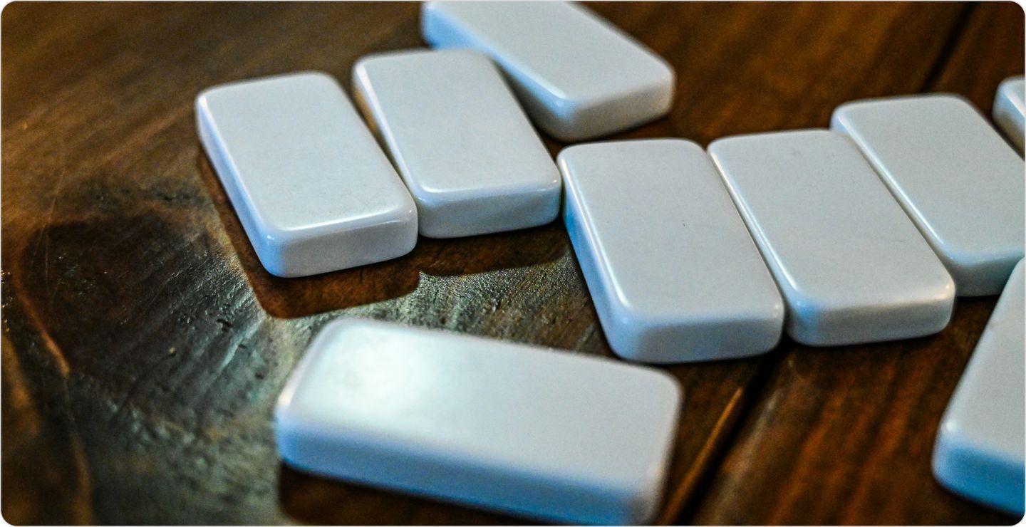 Tiles upside down on a table, illustrating randomized experimental design.