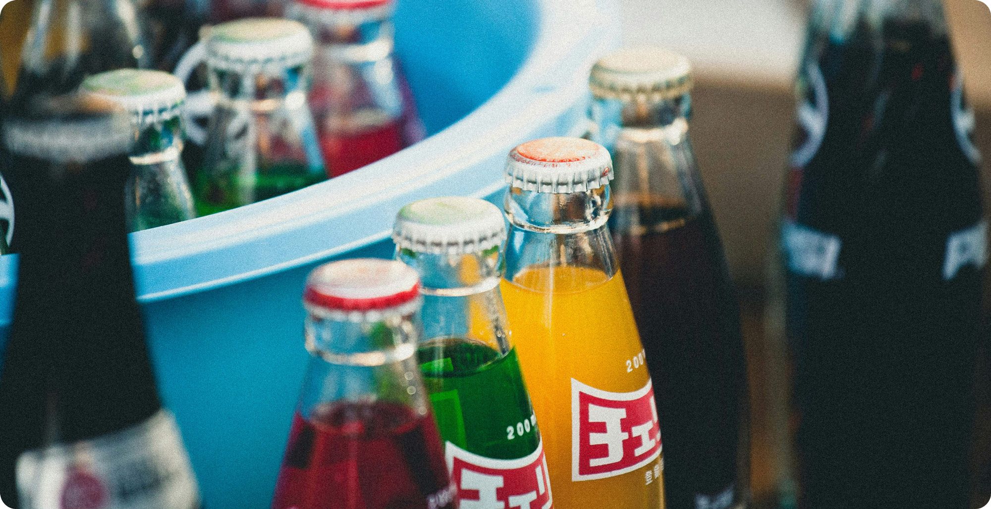 Image of bottled sodas: to illustrate substitute products/goods in cross price elasticity.
