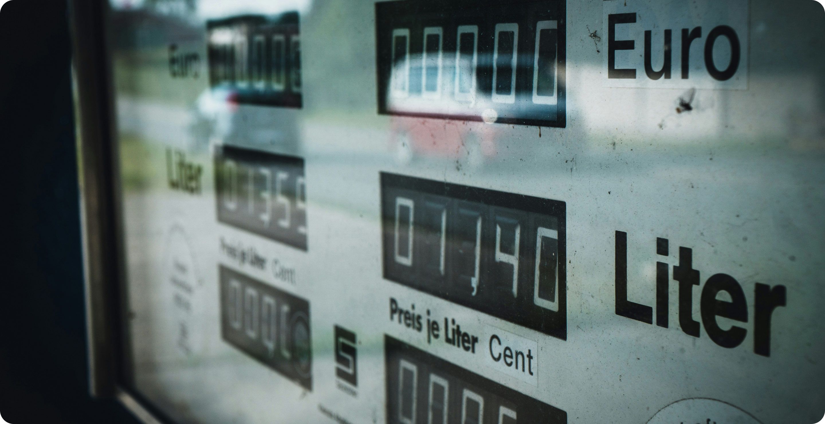 Image of a gas station pump screen with numbers for the liters and price for gas. 