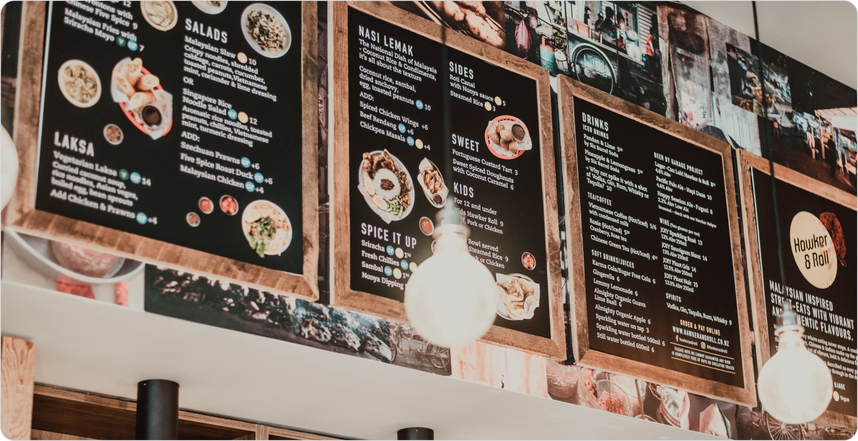 Restaurant menu boards above registers illustrating the price of different products