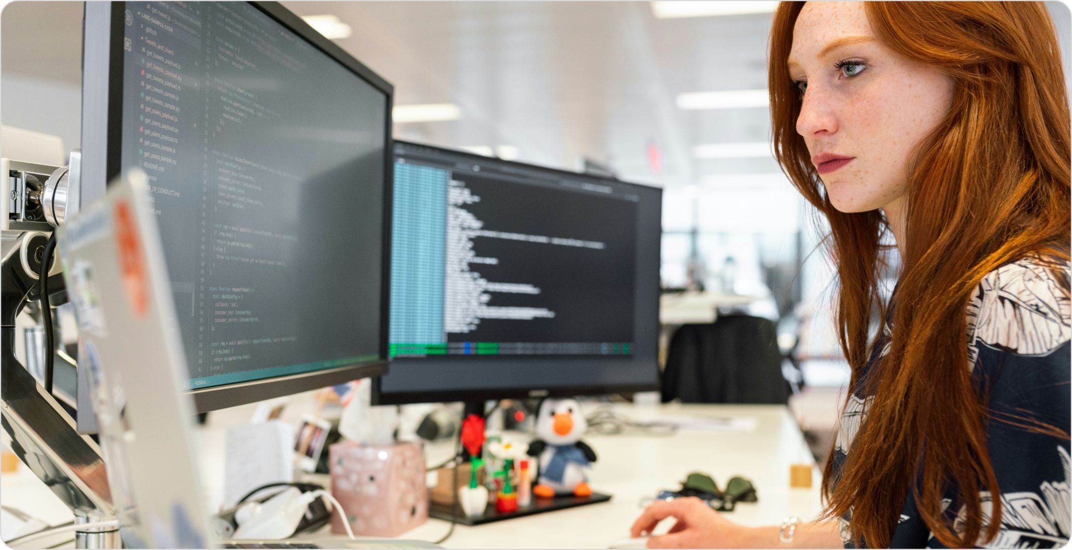 A woman at a workstation using a computer with analytical software. Representing diagnostic analytics