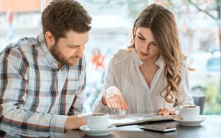 <p>Couple looking at a menu -Menu based choice</p>